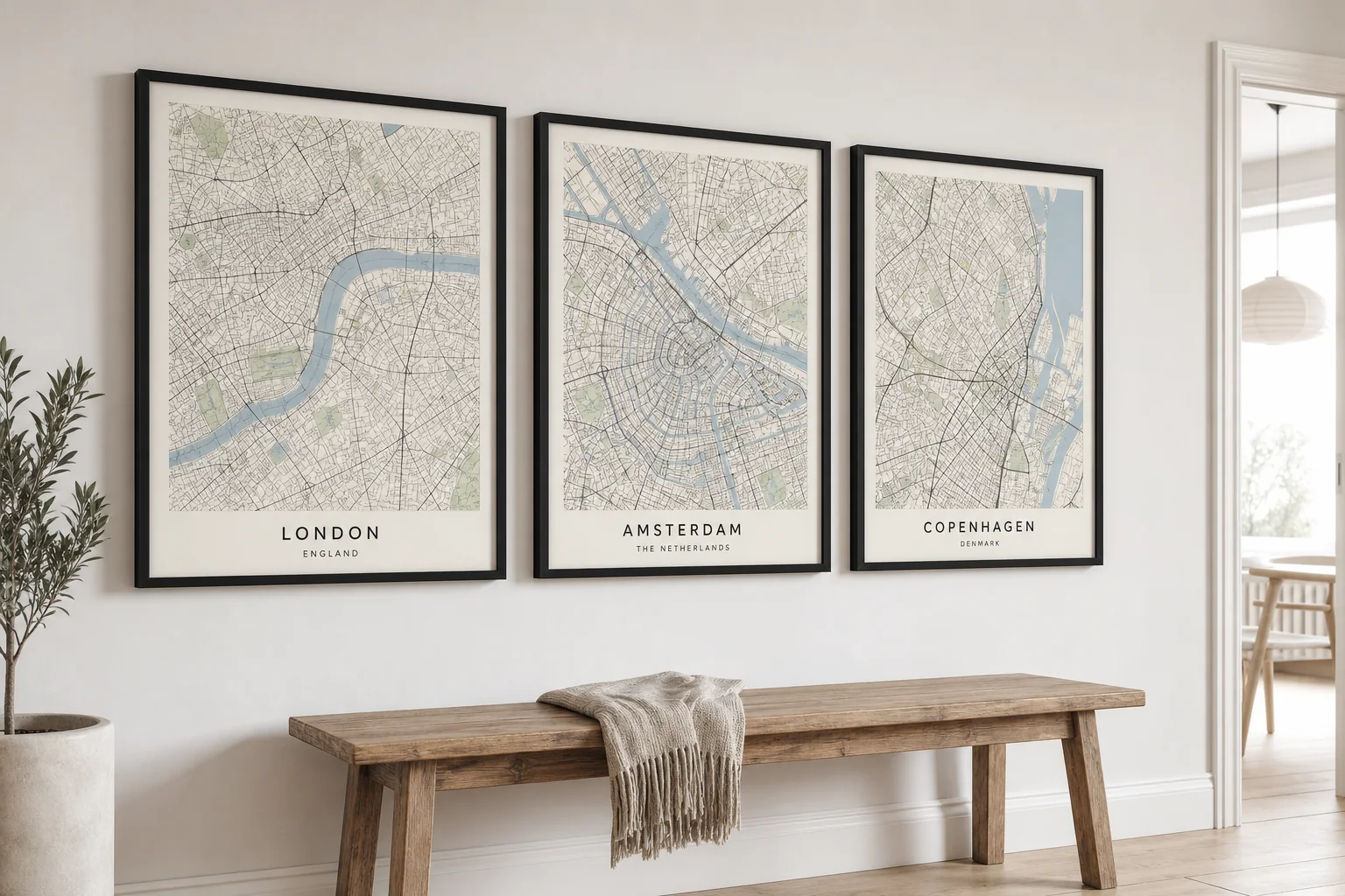Set of three custom city map prints framed in a row